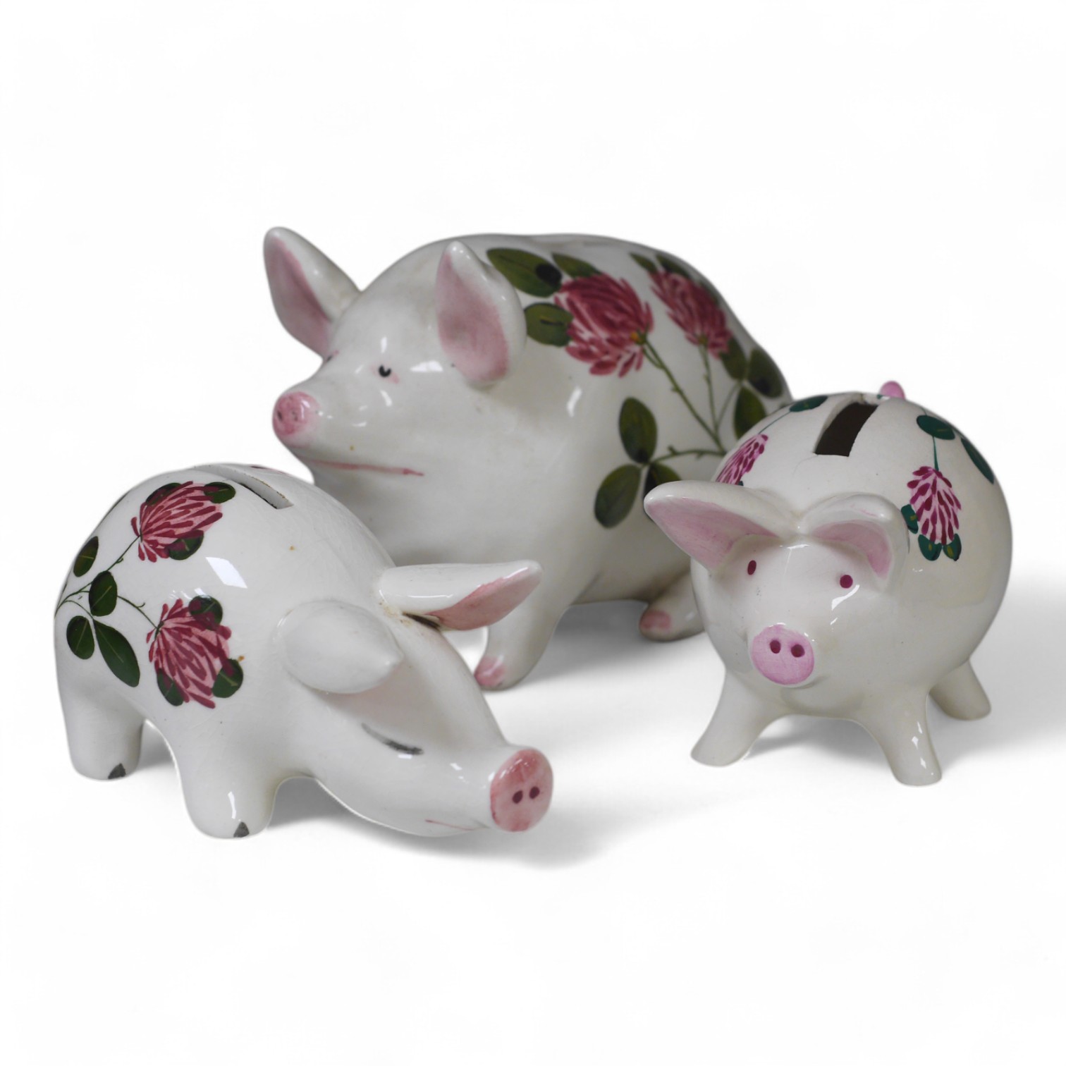 Three Plichta ‘pig’ ceramic money banks, each stamped to the bases, largest 16cm wide. Condition - fair